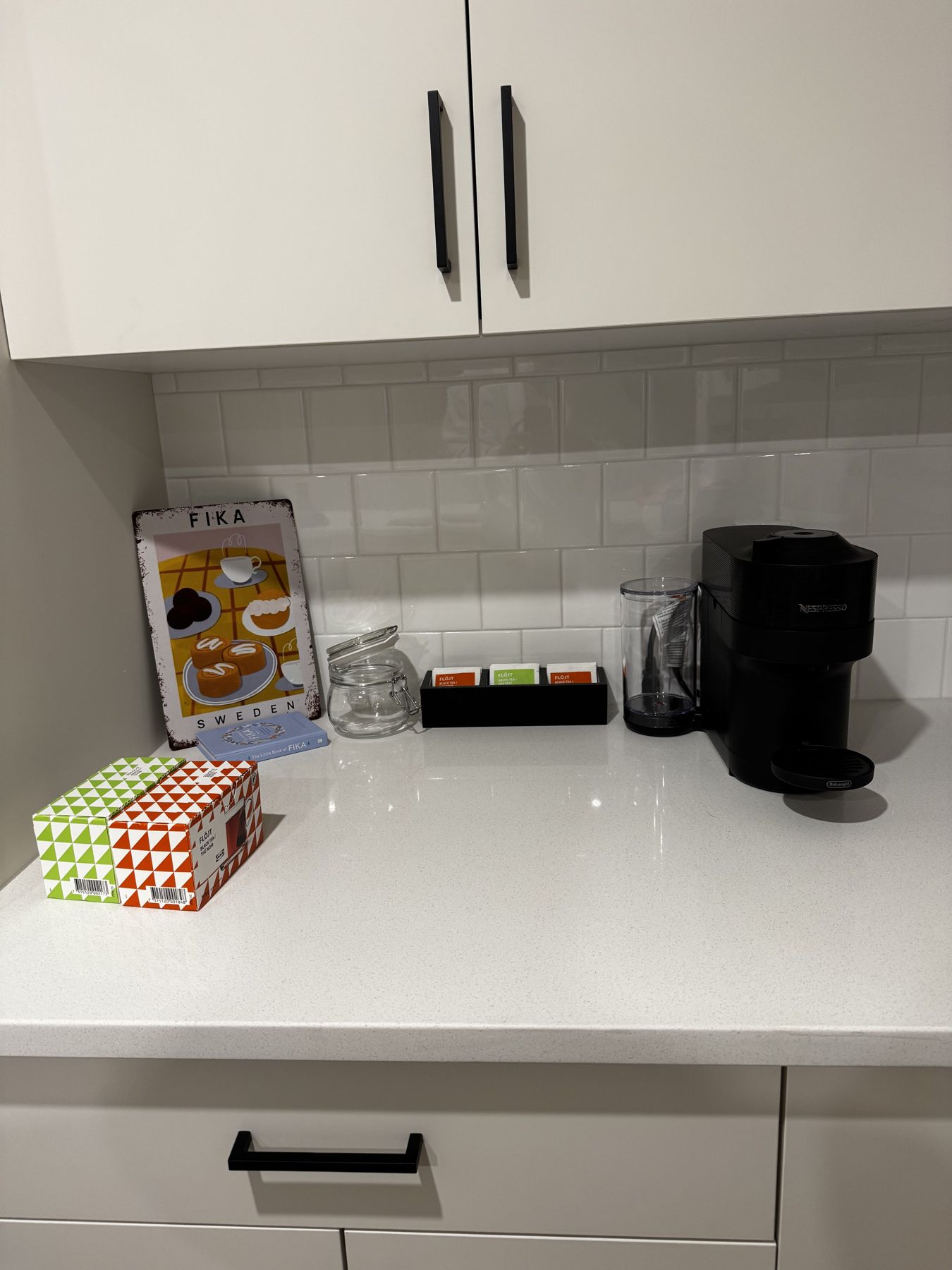 Coffee machine, Fika tin and treats on the counter