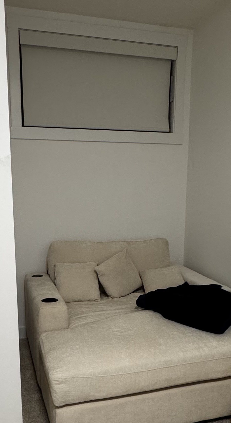 The reading chair tucked into the corner of the bedroom