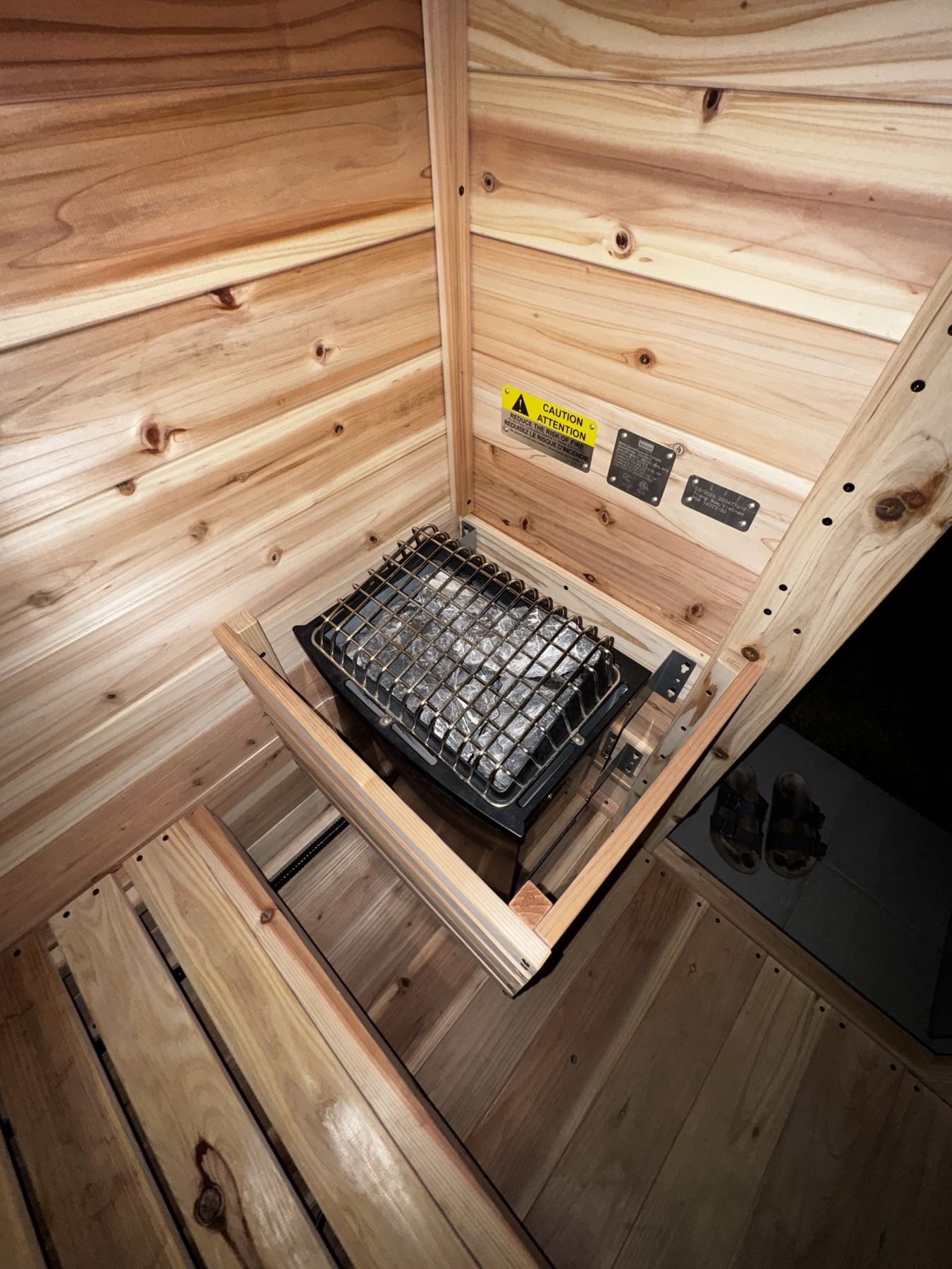 Sauna heater and stones in the cedar room